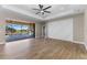 Spacious living room showcasing seamless indoor-outdoor living with views of the pool and outdoor kitchen at 2523 Dixon Ter, Port Charlotte, FL 33981
