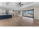 Open-concept living area with a modern kitchen, tile floors, and sliding glass doors overlooking the pool at 2523 Dixon Ter, Port Charlotte, FL 33981