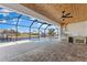 Screened-in lanai featuring a pool, outdoor kitchen, and beautiful waterfront views at 2523 Dixon Ter, Port Charlotte, FL 33981
