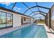 Relaxing screened-in pool area with brick pavers, ready for outdoor living at 2523 Dixon Ter, Port Charlotte, FL 33981