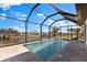 Inviting screened-in pool area with access to the waterway for waterfront enjoyment at 2523 Dixon Ter, Port Charlotte, FL 33981