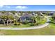Scenic aerial view showcasing the property's well-manicured landscaping, screened lanai, and desirable location at 25325 Longmeadow Dr, Punta Gorda, FL 33955