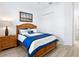 Bedroom featuring a wooden bed frame, ensuite and closet storage at 25325 Longmeadow Dr, Punta Gorda, FL 33955