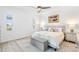 Bedroom with neutral colors, a large bed, a decorative rug, and water view at 25325 Longmeadow Dr, Punta Gorda, FL 33955