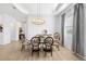 Bright dining room features a glass table with modern chandelier and decorative furnishings at 25325 Longmeadow Dr, Punta Gorda, FL 33955