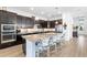 Elegant kitchen island boasting granite countertops, stainless appliances and dark cabinets at 25325 Longmeadow Dr, Punta Gorda, FL 33955