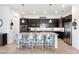Stylish kitchen with granite countertops, stainless steel appliances, and a large island at 25325 Longmeadow Dr, Punta Gorda, FL 33955