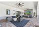 Inviting outdoor lounge area with a fireplace and comfortable seating at 25325 Longmeadow Dr, Punta Gorda, FL 33955