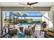 Screened-in patio features seating and pool views at 25325 Longmeadow Dr, Punta Gorda, FL 33955