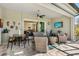 Covered patio featuring dining and lounge areas at 25325 Longmeadow Dr, Punta Gorda, FL 33955