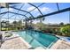 Sparkling pool with waterfall features offering a refreshing oasis for relaxation and enjoyment at 25325 Longmeadow Dr, Punta Gorda, FL 33955