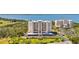 Aerial view of a condominium complex with lush landscaping, parking, and views of the intercoastal waterway at 2625 Terra Ceia Bay Blvd # 206, Palmetto, FL 34221
