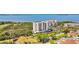 Aerial view featuring lush landscaping, two buildings and water views at 2625 Terra Ceia Bay Blvd # 206, Palmetto, FL 34221