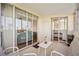 Spacious balcony with patio furniture and glass doors leading into the living room and bedroom at 2625 Terra Ceia Bay Blvd # 206, Palmetto, FL 34221