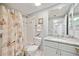Updated bathroom with granite countertop, shower and tub with decorative shower curtain at 2625 Terra Ceia Bay Blvd # 206, Palmetto, FL 34221