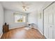 Bright bedroom featuring wood floors, ceiling fan and natural light from the window at 2625 Terra Ceia Bay Blvd # 206, Palmetto, FL 34221