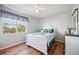 Charming bedroom with a full-sized bed, a ceiling fan, a window with blinds, and a dresser at 2625 Terra Ceia Bay Blvd # 206, Palmetto, FL 34221