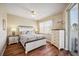 Comfortable bedroom featuring a ceiling fan, a dresser, and a sliding glass door to the balcony at 2625 Terra Ceia Bay Blvd # 206, Palmetto, FL 34221
