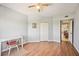 A bedroom featuring wood floors, a ceiling fan, closet and a small desk at 2625 Terra Ceia Bay Blvd # 206, Palmetto, FL 34221