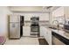 Kitchen featuring stainless steel appliances, white cabinets and granite countertops at 2625 Terra Ceia Bay Blvd # 206, Palmetto, FL 34221