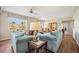 Cozy living room showcasing comfortable seating and an open layout connecting to the dining area at 2625 Terra Ceia Bay Blvd # 206, Palmetto, FL 34221