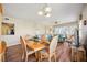 Living room and dining area with hardwood floors, open floorplan, and water views at 2625 Terra Ceia Bay Blvd # 206, Palmetto, FL 34221
