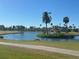 Scenic pond view with palm trees and a gazebo offering a serene, picturesque landscape at 2625 Terra Ceia Bay Blvd # 206, Palmetto, FL 34221