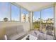 Relaxing screened porch with comfortable seating, offering views of the surrounding neighborhood at 2625 Terra Ceia Bay Blvd # 206, Palmetto, FL 34221