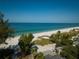 Stunning aerial view of the beach with clear water and beautiful landscape, with beachside home at 3000 Gulf Dr # 3, Holmes Beach, FL 34217