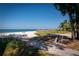 Scenic beach view featuring pristine white sand, turquoise waters, and lush vegetation at 3000 Gulf Dr # 3, Holmes Beach, FL 34217