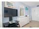 Bedroom showcasing a large flat screen tv, white dresser and coastal decor for a modern look at 3000 Gulf Dr # 3, Holmes Beach, FL 34217