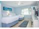 Cozy bedroom featuring two beds, ample natural light, and a serene atmosphere at 3000 Gulf Dr # 3, Holmes Beach, FL 34217