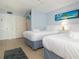 Inviting bedroom featuring two beds, neutral walls, and an inviting atmosphere for a restful night at 3000 Gulf Dr # 3, Holmes Beach, FL 34217