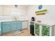Updated kitchen with white cabinets, modern appliances, a coffee bar, and decorative accents at 3000 Gulf Dr # 3, Holmes Beach, FL 34217