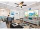 Cozy living room with a dining area, tile floors, and bright kitchen in an open concept at 3000 Gulf Dr # 3, Holmes Beach, FL 34217