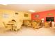 Inviting lounge area with comfortable seating, including wicker chairs and a cozy couch at 3000 Gulf Dr # 3, Holmes Beach, FL 34217