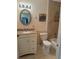 Beautiful bathroom featuring a granite vanity, toilet and tiled shower at 306 Barlow Ave # 77, Sarasota, FL 34232
