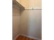 Walk in closet with white shelving and a hanging rod at 306 Barlow Ave # 77, Sarasota, FL 34232