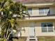 Inviting front entrance featuring well-maintained landscaping, offering a warm welcome to this charming home at 306 Barlow Ave # 77, Sarasota, FL 34232