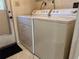 Bright laundry room features a washer and dryer for convenient in-home laundry at 306 Barlow Ave # 77, Sarasota, FL 34232