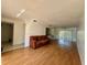 Bright living room featuring hardwood floors, with a large window providing ample natural light at 306 Barlow Ave # 77, Sarasota, FL 34232