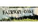 Fairway Oaks entrance sign surrounded by manicured landscaping showcasing a well-kept community at 306 Barlow Ave # 77, Sarasota, FL 34232