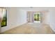 Light-filled bedroom with sliding glass doors, seamlessly blending indoor and outdoor living at 3640 Aster Dr, Sarasota, FL 34233