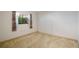 Bedroom featuring natural light from a window with charming floral curtains at 3640 Aster Dr, Sarasota, FL 34233