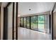 Bright sunroom with large windows offering serene outdoor views and natural light at 3640 Aster Dr, Sarasota, FL 34233