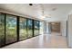 Bright sunroom with large windows offering serene outdoor views and natural light at 3640 Aster Dr, Sarasota, FL 34233