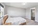 Minimalist bedroom design with neutral colors, plush carpeting, and access to ensuite bathroom at 3663 Quiet Dr, Sarasota, FL 34240