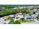 Aerial shot highlights the property's landscaped yard, pool, and privacy fencing at 4008 Cape Vista Dr, Bradenton, FL 34209