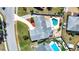 An aerial view showcases the backyard pool, patio, roof, and driveway of the property at 4008 Cape Vista Dr, Bradenton, FL 34209