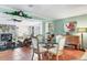 Cozy dining area adjacent to living room features decorative accents and comfortable seating at 4008 Cape Vista Dr, Bradenton, FL 34209